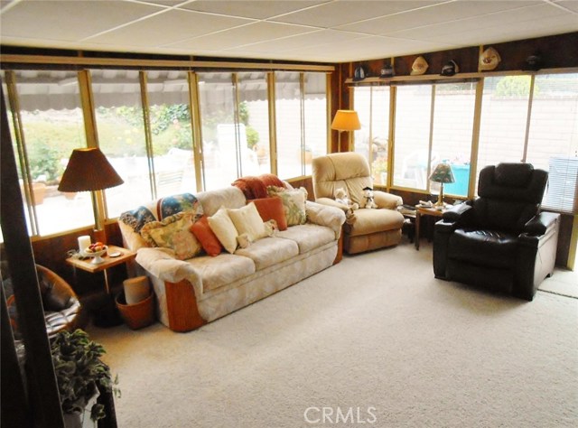 Enclosed Patio with Blinds all around and Carpet for some really "Comfy" living! Or Pull the Shades all the way up and have full view to Backyard for Watching the kids or Entertaining.