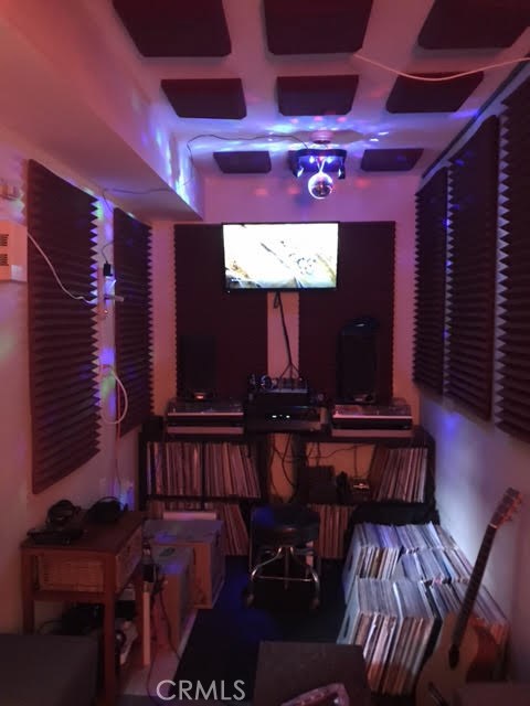Karaoke or music room with professional soundproofing built by the owner and is really a fun place that can comfortably seat eight adults for a fun evening.