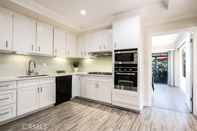 Newly Remodeled Kitchen: Floor, Quartz Counter Tops, Cabinets, Backsplash and Oven are Brand New