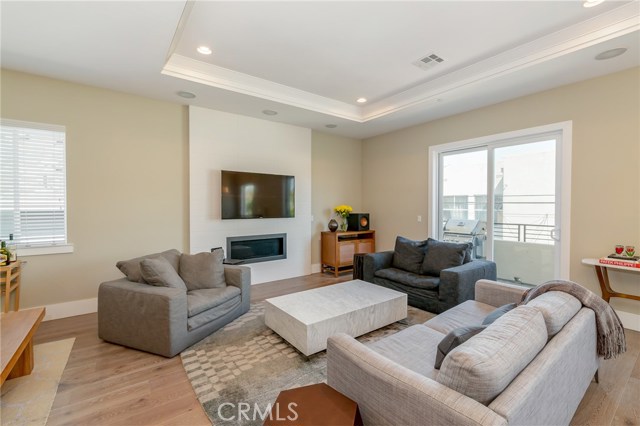 Soaring ceilings, high performance speakers, private balcony designer fireplace... all the bells and whistles