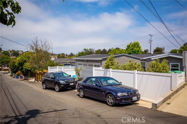 A look at things from the alley. Parking for 2 in the 2-car garage, and room for 2 more as shown here.