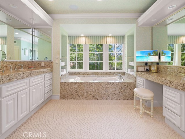 Master Bathroom - with double vanity, his & hers walk-in closets...