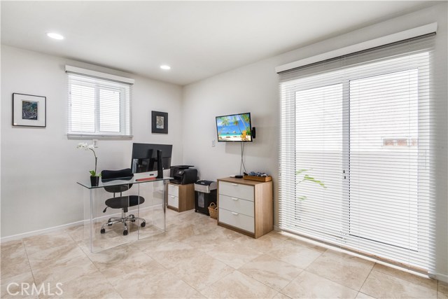 Downstairs office or bedroom with sliding door entrance