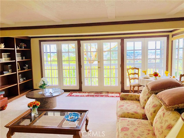  Family Room lower Level with  marble stairway.Fireplace and book Shelves. THIS LEVEL also has a PRIVATE ENTRANCE from the Gate at the right side of Garage Door.