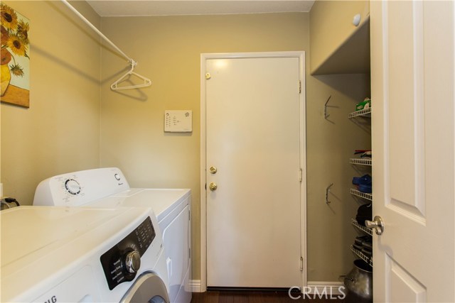 Laundry/Utility with Floor to Ceiling Storage Shelving on Right