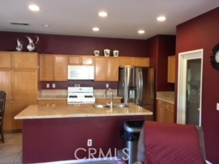 Kitchen with granite countertop and island