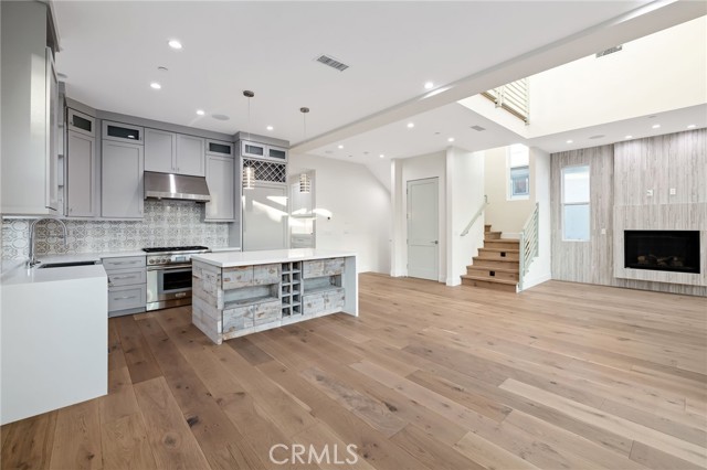 Centrally anchored kitchen with center island and breakfast seating