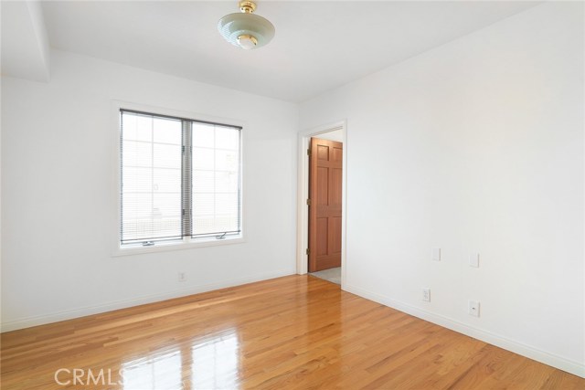 This is the formal dining room. Door leads to first level bedroom with new carpeting. The first level has one bedroom, dining, family and living rooms. There is alot of versatility available with this floorplan.