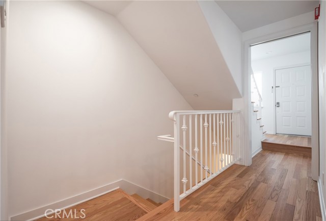 Front door plus stairs down to garage and laundry area