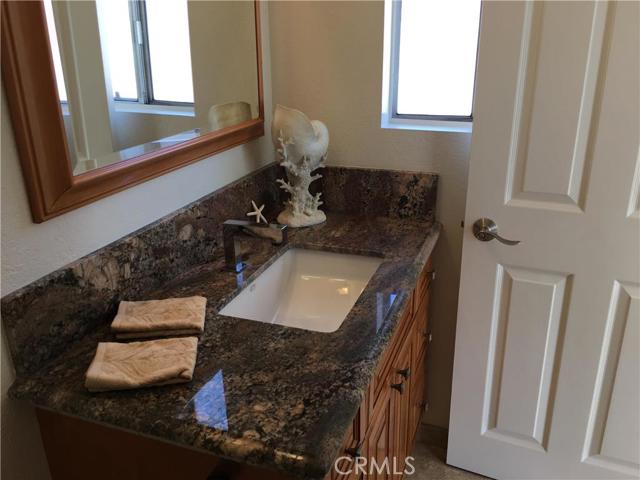 Remodeled Guest Bath with Granite and motion sensor for water.