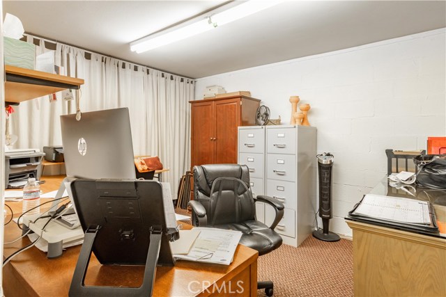 Large bonus room downstairs, adjacent to  3 car garage; perfect for a 4th bedroom or man cave. Plenty more room behind the curtains.