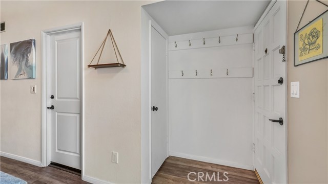 Front entrance with Coat closet and Door to garage.