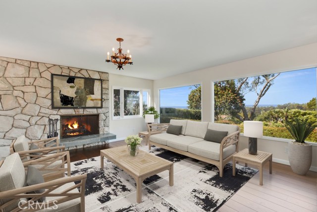 Living room has views of bay, mountains, city lights, parkland and new wood floors, custom cabinets and stained glass entry doors