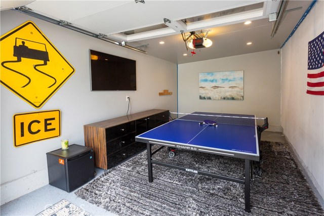 FINISHED MEDIA/PLAY ROOM OFF BACKYARD (ONE OF GARAGE BAYS)