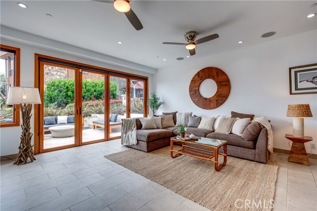 Enter from the walkstreet and enjoy white water and MB Pier views from the sitting patio which enters through Nano doors to the lower level family room.