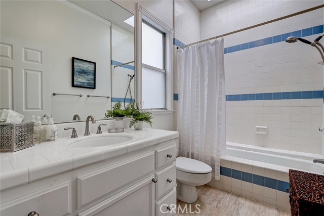Master bathroom with freshly painted cabinets with new hardware and updated light fixtures.