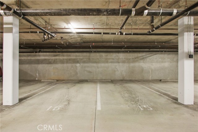 2 side-by-side parking spaces in gated garage.