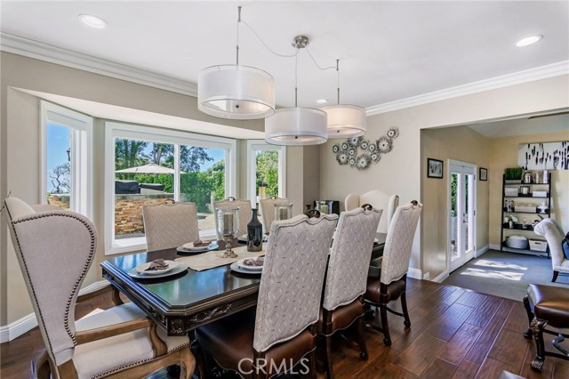 Formal dining room is spacious and updated with modern fixtures.