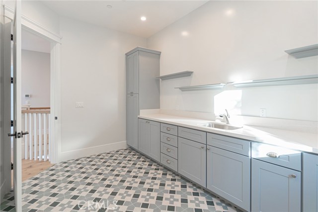 View of laundry room from back laundry room wall.