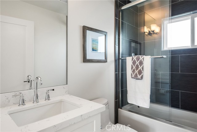One of four full bathrooms, this one is upstairs off the mezzanine.