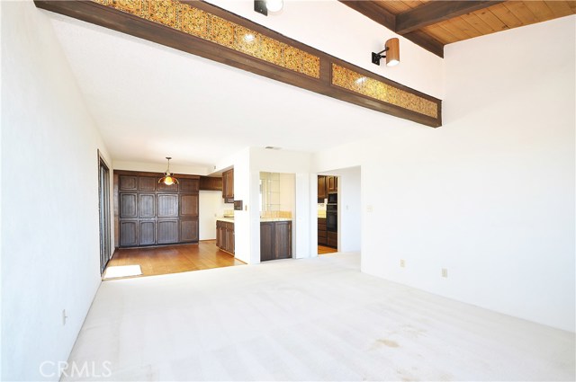 View from the family room toward eat in kitchen/ kitchen and minibar area