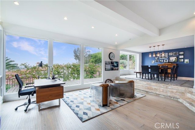 Large windows for taking on vistas. New hardwood floors, recessed lighting.