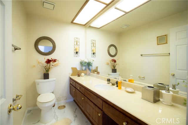 Hallway bathroom adjacent to dining room