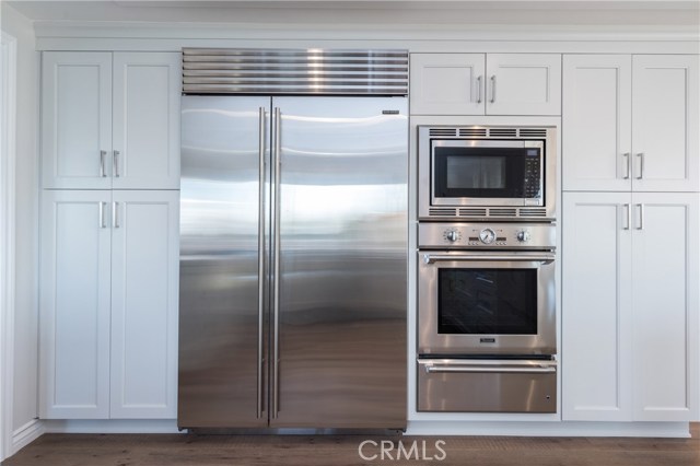 Tons of storage in this kitchen!  2 pantries, 48 inch subzero fridge (with water and ice inside), convection oven, warming drawer, and microwave shown!