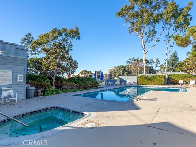 Another view of the pool, spa, and sauna area - all just steps from this unit!