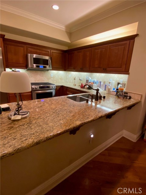 Kitchen - Wide Granite Counters for casual dining with extended Counters for bar stools.