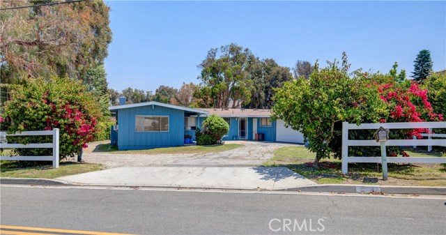 Front of the Classic Ranch Home Built in 1961. One owner and 60 years of Equestrian Family memories. Home is in original condition, but does have a two year old roof, new front fencing and new garage door.