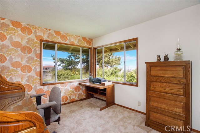 One of the two upstairs secondary bedrooms, this one with AMAZING city views
