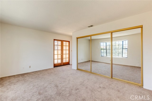 Master Bedroom is light and bright and features a large mirrored closet, en-suite full bathroom and private balcony.