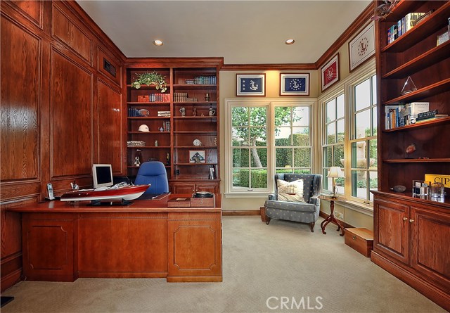 Paneled Home Office/Library enjoys private garden view.