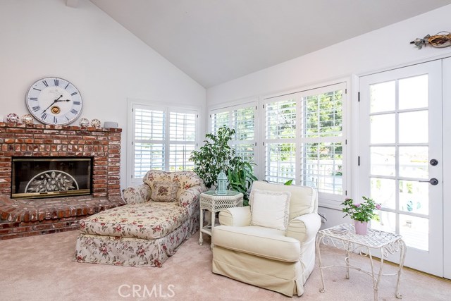 Family room with lots of windows and door opening to deck