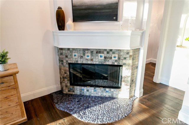 Fireplace and entrance to 1/2 bath