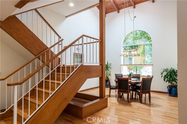Spacious formal Dining Room has large skylight, huge windows and towering vaulted ceilings.