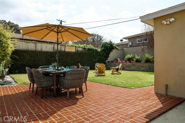 Outdoor dining and sitting area in back yard