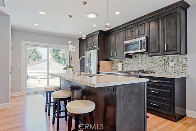 new kitchen with sliders leading to backyard