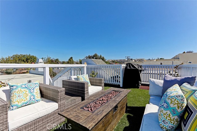 Rooftop deck right off of kitchen with BBQ area.