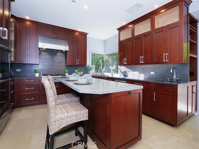 Tastefully remodeled kitchen with a center island and lot of storage