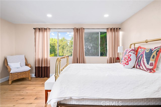 Downstairs bedroom with views of lush landscape.