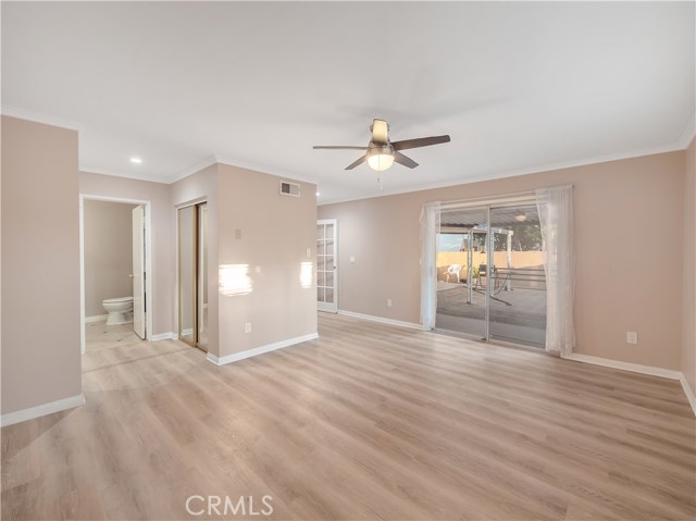 Huge master bedroom with three closets and master bath. Access to back patio through sliding glass doors.