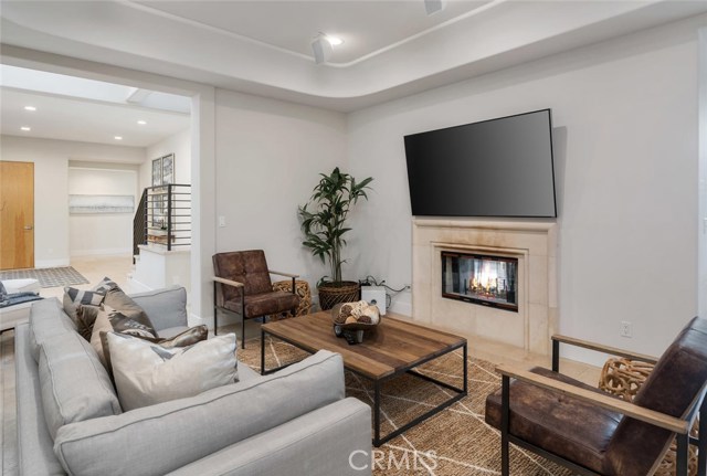 living room with see through fireplace