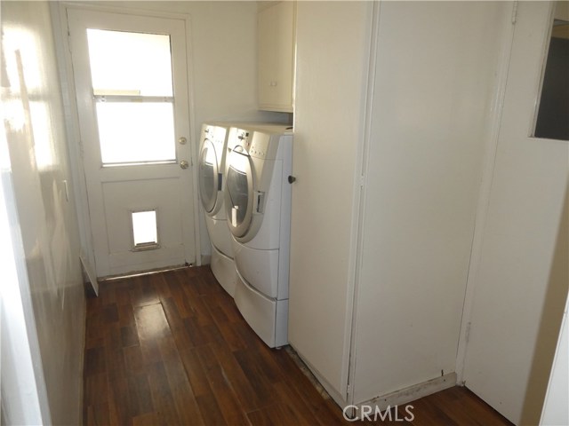 Laundry area and door to BBQ area and garage.
