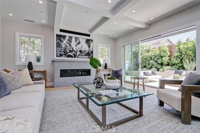 Living room leads out to outdoor patio and yard