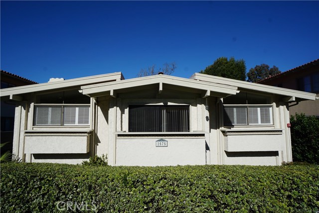 Pictured from the street. Two story townhouse with 3 upstairs Light-filled bedrooms, middle hall bedroom has balcony. Plantation shutters, clerestory windows. Downstairs main rooms opens to a private courtyard entry.