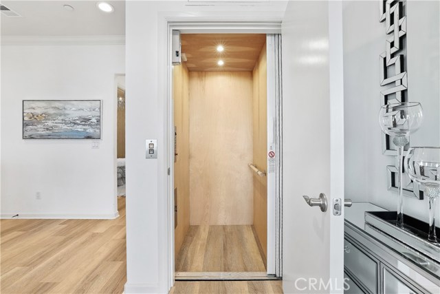 Private interior elevator to lower level bedrooms and patio