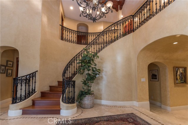 Truly elegant curved stairway is breathtaking!