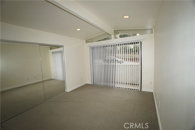 Middle bedroom #2.  Architectural ceilings and windows create space and character.